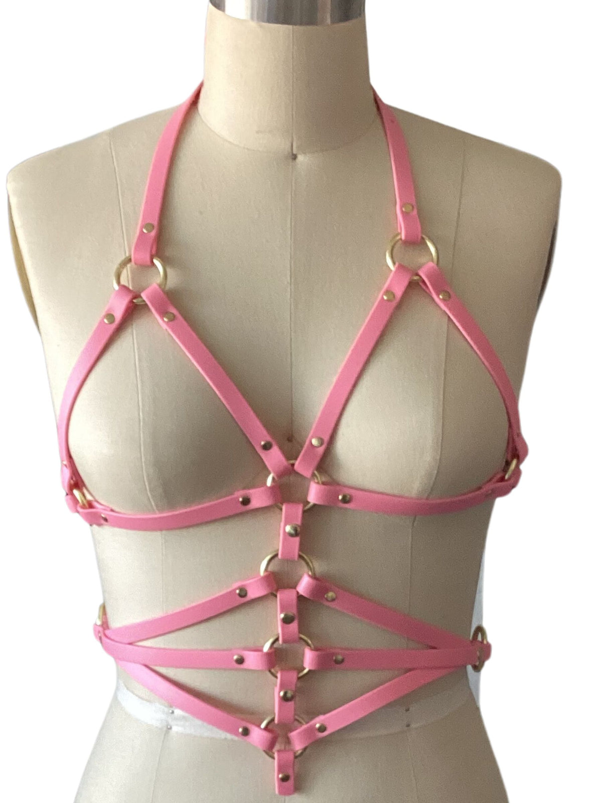 Pastel pink classic harness top outfit for women shown on a mannequin against a white background.