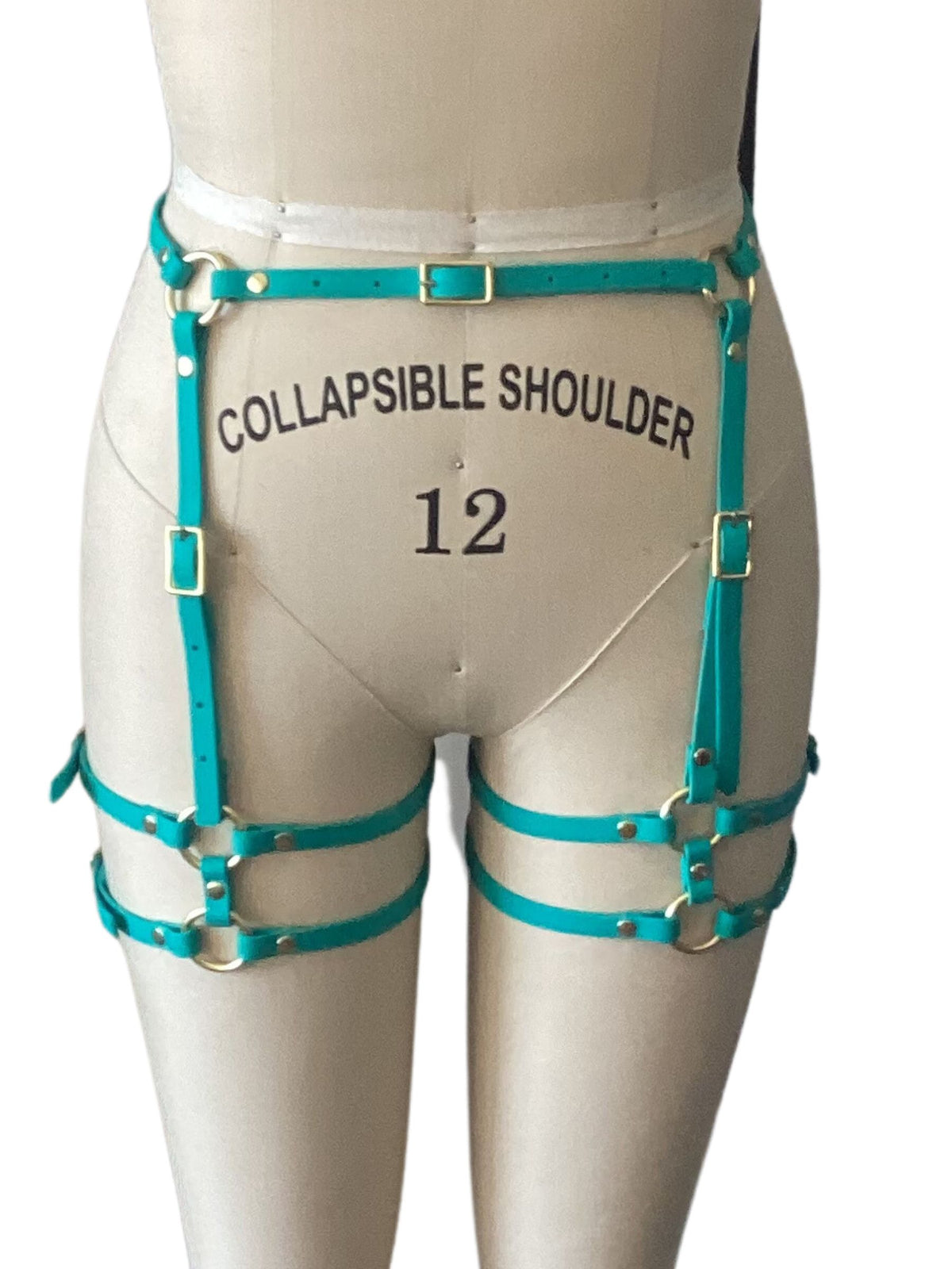 a turquoise blue waist and thigh harness on a size 12 mannequin on a white background